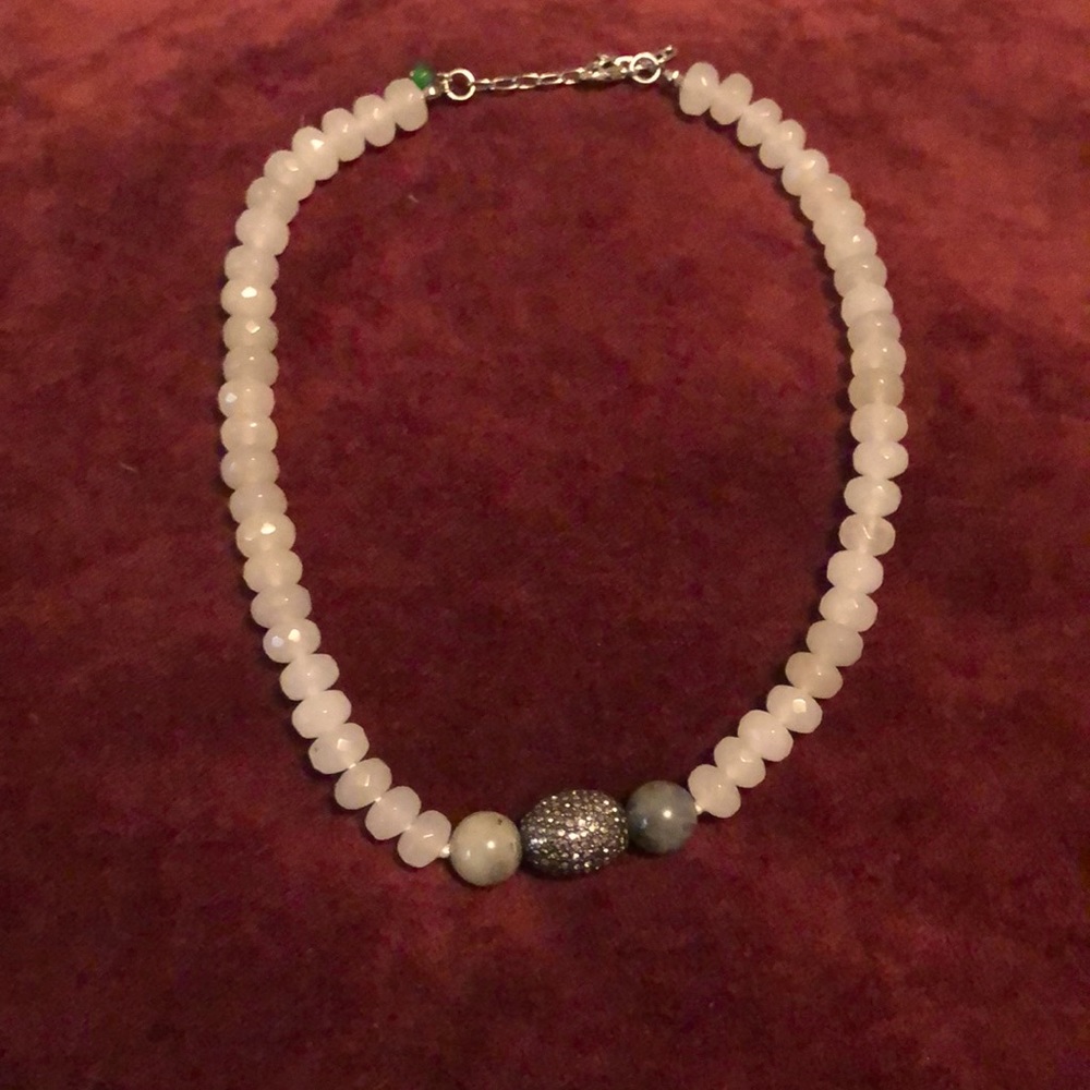 Mgems beaded necklace. Light grey marble larger beads surrounded a pave oval.